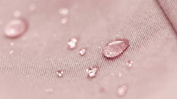 Editorial illustration for How Self-Cleaning and Temperature-Regulating Fabrics Actually Work